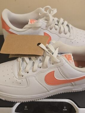 Nike White Low-Top Sneakers with Coral Swoosh